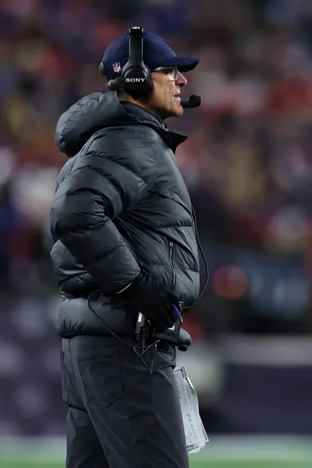 FOXBOROUGH, MASSACHUSETTS - JANUARY 11: Head coach Jim Harbaugh of the Los Angeles Chargers looks on during the third quarter of the AFC Wild Card Playoff game against the New England Patriots at Gillette Stadium on January 11, 2026 in Foxborough, Massachusetts. (Photo by Sarah Stier/Getty Images)