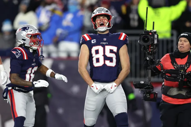 FOXBOROUGH, MASSACHUSETTS - JANUARY 11: Hunter Henry #85 of the New England Patriots celebrates with teammate Kyle Williams #18 after a touchdown against the Los Angeles Chargers during the fourth quarter of the AFC Wild Card Playoff game at Gillette Stadium on January 11, 2026 in Foxborough, Massachusetts. (Photo by Adam Glanzman/Getty Images)