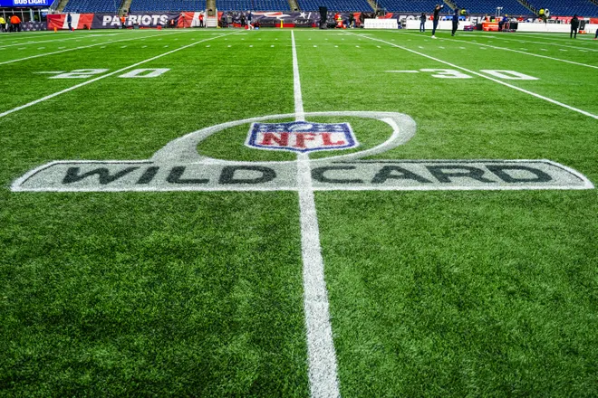 Jan 11, 2026; Foxborough, MA, USA; A view of the NFL Wild Card logo on the field before the game between the New England Patriots and the Los Angeles Chargers in an AFC Wild Card Round game at Gillette Stadium. Mandatory Credit: David Butler II-Imagn Images