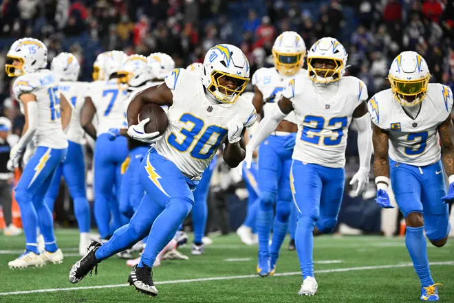 Jan 11, 2026; Foxborough, MA, USA; Los Angeles Chargers running back Kimani Vidal (30) warms up before the game against the New England Patriots in an AFC Wild Card Round game at Gillette Stadium. Mandatory Credit: Eric Canha-Imagn Images
