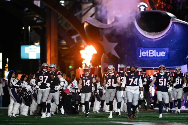 Jan 11, 2026; Foxborough, MA, USA; The New England Patriots take the field before the game against the Los Angeles Chargers in an AFC Wild Card Round game at Gillette Stadium. Mandatory Credit: Eric Canha-Imagn Images