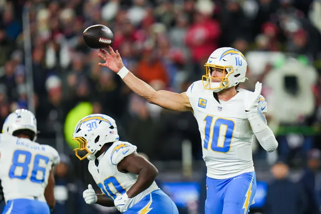 Jan 11, 2026; Foxborough, MA, USA; Los Angeles Chargers quarterback Justin Herbert (10) throws a pass during the first quarter against the New England Patriots in an AFC Wild Card Round game at Gillette Stadium. Mandatory Credit: David Butler II-Imagn Images