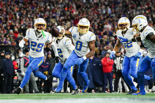 Jan 11, 2026; Foxborough, MA, USA; Los Angeles Chargers linebacker Daiyan Henley (0) celebrates an interception during the first quarter against the New England Patriots in an AFC Wild Card Round game at Gillette Stadium. Mandatory Credit: David Butler II-Imagn Images