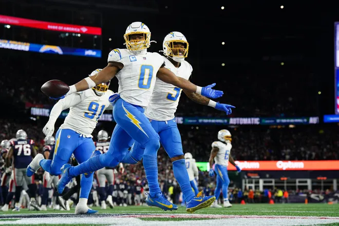 Jan 11, 2026; Foxborough, MA, USA; Los Angeles Chargers linebacker Daiyan Henley (0) celebrates an interception during the first quarter against the New England Patriots in an AFC Wild Card Round game at Gillette Stadium. Mandatory Credit: David Butler II-Imagn Images