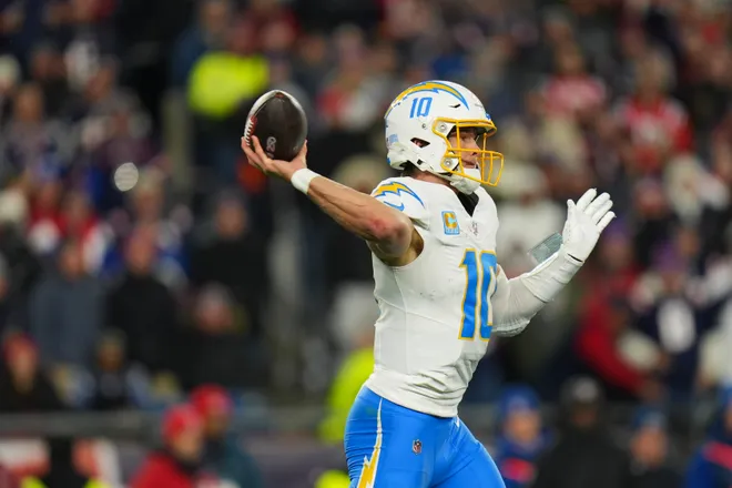Jan 11, 2026; Foxborough, MA, USA; Los Angeles Chargers quarterback Justin Herbert (10) throws a pass during the second quarter against the New England Patriots in an AFC Wild Card Round game at Gillette Stadium. Mandatory Credit: David Butler II-Imagn Images