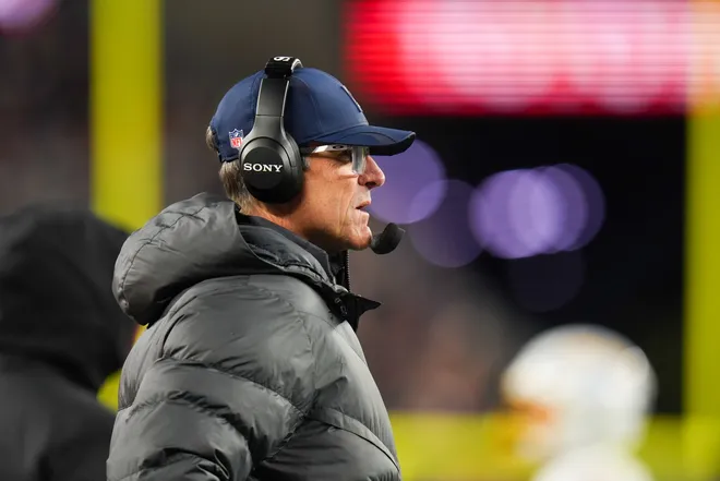 Jan 11, 2026; Foxborough, MA, USA; Los Angeles Chargers head coach Jim Harbaugh looks on during the second quarter against the New England Patriots in an AFC Wild Card Round game at Gillette Stadium. Mandatory Credit: David Butler II-Imagn Images