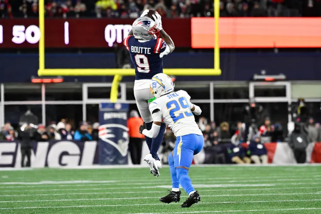 Jan 11, 2026; Foxborough, MA, USA; New England Patriots wide receiver Kayshon Boutte (9) makes a catch as Los Angeles Chargers cornerback Tarheeb Still (29) defends during the second quarter in an AFC Wild Card Round game at Gillette Stadium. Mandatory Credit: Eric Canha-Imagn Images