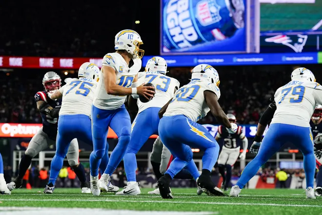Jan 11, 2026; Foxborough, MA, USA; Los Angeles Chargers quarterback Justin Herbert (10) drops back to pass during the second quarter against the New England Patriots in an AFC Wild Card Round game at Gillette Stadium. Mandatory Credit: David Butler II-Imagn Images