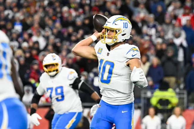 Jan 11, 2026; Foxborough, MA, USA; Los Angeles Chargers quarterback Justin Herbert (10) throws a pass during the second quarter against the New England Patriots in an AFC Wild Card Round game at Gillette Stadium. Mandatory Credit: Eric Canha-Imagn Images