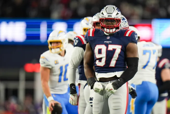 Jan 11, 2026; Foxborough, MA, USA; New England Patriots defensive end Milton Williams (97) celebrates a sack during the second quarter against the Los Angeles Chargers in an AFC Wild Card Round game at Gillette Stadium. Mandatory Credit: David Butler II-Imagn Images