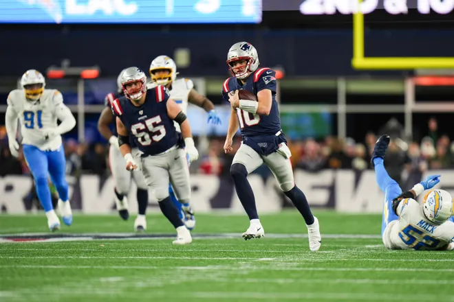 Jan 11, 2026; Foxborough, MA, USA; New England Patriots quarterback Drake Maye (10) rushes during the second quarter against the Los Angeles Chargers in an AFC Wild Card Round game at Gillette Stadium. Mandatory Credit: David Butler II-Imagn Images