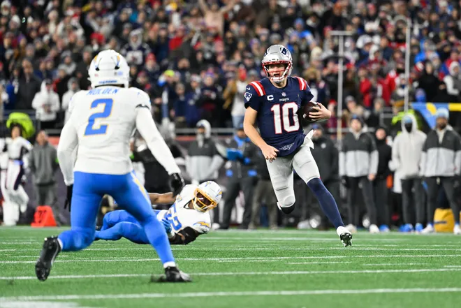 Jan 11, 2026; Foxborough, MA, USA; New England Patriots quarterback Drake Maye (10) rushes during the second quarter against the Los Angeles Chargers in an AFC Wild Card Round game at Gillette Stadium. Mandatory Credit: Eric Canha-Imagn Images