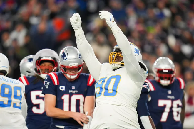 Jan 11, 2026; Foxborough, MA, USA; Los Angeles Chargers defensive tackle Teair Tart (90) celebrates a sack during the third quarter against the New England Patriots in an AFC Wild Card Round game at Gillette Stadium. Mandatory Credit: David Butler II-Imagn Images