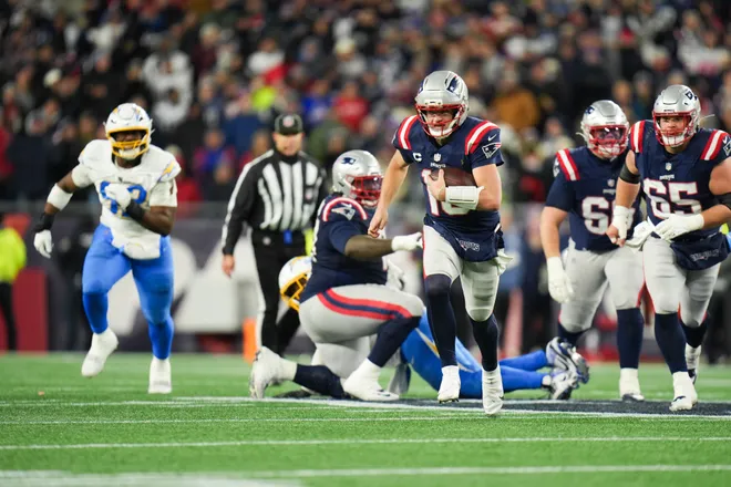 Jan 11, 2026; Foxborough, MA, USA; New England Patriots quarterback Drake Maye (10) scrambles for a gain during the fourth quarter against the Los Angeles Chargers in an AFC Wild Card Round game at Gillette Stadium. Mandatory Credit: David Butler II-Imagn Images