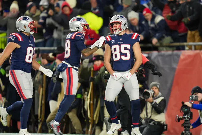 Jan 11, 2026; Foxborough, MA, USA; New England Patriots tight end Hunter Henry (85) celebrates with New England Patriots wide receiver Kyle Williams (18) after scoring a touchdown during the fourth quarter against the Los Angeles Chargers in an AFC Wild Card Round game at Gillette Stadium. Mandatory Credit: David Butler II-Imagn Images