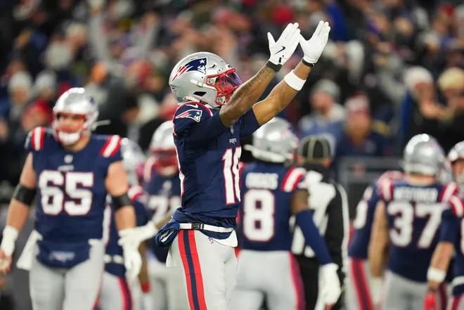 Jan 11, 2026; Foxborough, MA, USA; New England Patriots wide receiver Kyle Williams (18) celebrates a touchdown during the fourth quarter against the Los Angeles Chargers in an AFC Wild Card Round game at Gillette Stadium. Mandatory Credit: David Butler II-Imagn Images