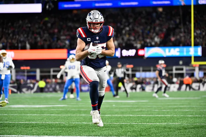 Jan 11, 2026; Foxborough, MA, USA; New England Patriots tight end Hunter Henry (85) scores a touchdown during the fourth quarter against the Los Angeles Chargers in an AFC Wild Card Round game at Gillette Stadium. Mandatory Credit: Eric Canha-Imagn Images