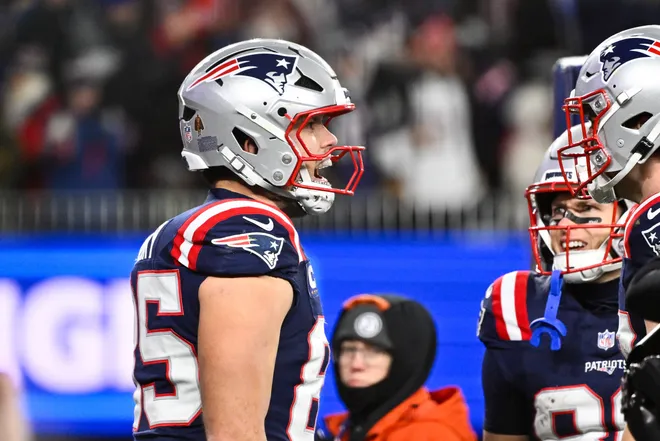 Jan 11, 2026; Foxborough, MA, USA; New England Patriots tight end Hunter Henry (85) celebrates after scoring a touchdown during the fourth quarter against the Los Angeles Chargers in an AFC Wild Card Round game at Gillette Stadium. Mandatory Credit: Eric Canha-Imagn Images