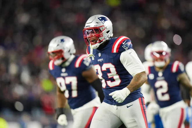 Jan 11, 2026; Foxborough, MA, USA; New England Patriots linebacker Anfernee Jennings (33) celebrates a sack during the fourth quarter against the Los Angeles Chargers in an AFC Wild Card Round game at Gillette Stadium. Mandatory Credit: David Butler II-Imagn Images