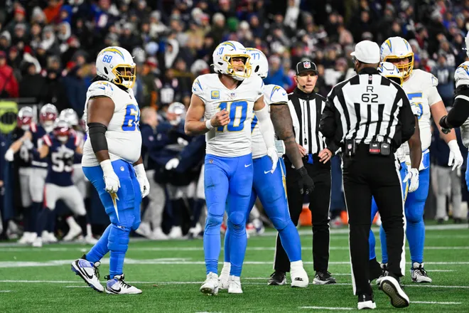 Jan 11, 2026; Foxborough, MA, USA; Los Angeles Chargers quarterback Justin Herbert (10) leaves the field after being sacked during the fourth quarter against the New England Patriots in an AFC Wild Card Round game at Gillette Stadium. Mandatory Credit: Eric Canha-Imagn Images