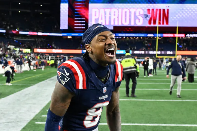 Jan 11, 2026; Foxborough, MA, USA; New England Patriots wide receiver Stefon Diggs (8) reacts after defeating the Los Angeles Chargers in an AFC Wild Card Round game at Gillette Stadium. Mandatory Credit: Eric Canha-Imagn Images