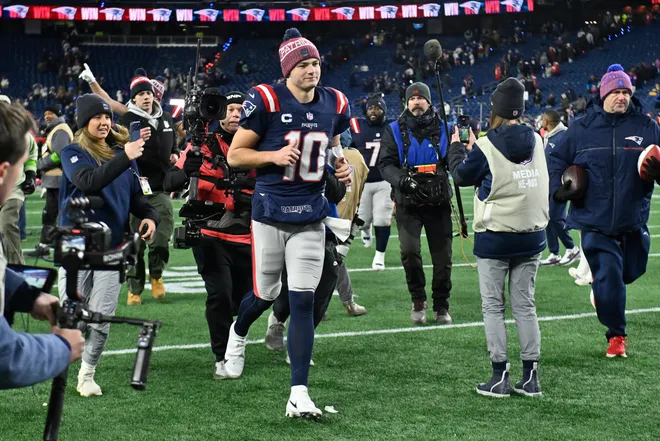 Jan 11, 2026; Foxborough, MA, USA; New England Patriots quarterback Drake Maye (10) jogs off the field after defeating the Los Angeles Chargers in an AFC Wild Card Round game at Gillette Stadium. Mandatory Credit: Eric Canha-Imagn Images