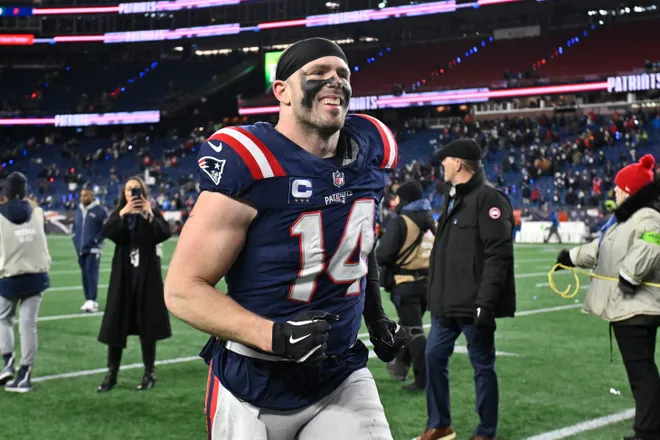 Jan 11, 2026; Foxborough, MA, USA;New England Patriots linebacker Robert Spillane (14) jogs off the field after defeating the Los Angeles Chargers in an AFC Wild Card Round game at Gillette Stadium. Mandatory Credit: Eric Canha-Imagn Images