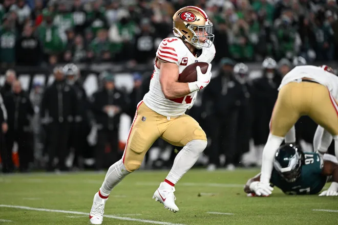 Jan 11, 2026; Philadelphia, PA, USA; San Francisco 49ers running back Christian McCaffrey (23) carries the ball against the Philadelphia Eagles during the first quarter in an NFC Wild Card Round game at Lincoln Financial Field. Mandatory Credit: Eric Hartline-Imagn Images