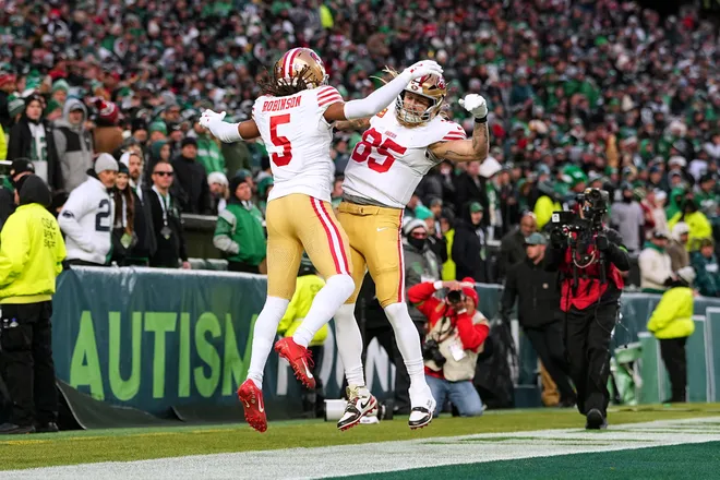 PHILADELPHIA, PENNSYLVANIA - JANUARY 11: Demarcus Robinson #5 and George Kittle #85 of the San Francisco 49ers celebrate after Robinson's receiving touchdown against the Philadelphia Eagles during the first quarter in the NFC Wild Card Playoff game at Lincoln Financial Field on January 11, 2026 in Philadelphia, Pennsylvania. (Photo by Mitchell Leff/Getty Images)