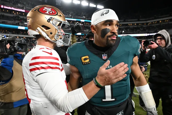 Jan 11, 2026; Philadelphia, PA, USA; San Francisco 49ers quarterback Brock Purdy (13) speaks with Philadelphia Eagles quarterback Jalen Hurts (1) after an NFC Wild Card Round game at Lincoln Financial Field. Mandatory Credit: Eric Hartline-Imagn Images
