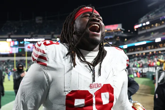 PHILADELPHIA, PENNSYLVANIA - JANUARY 11: C.J. West #99 of the San Francisco 49ers celebrates after his team's 23-19 win against the Philadelphia Eagles in the NFC Wild Card Playoff game at Lincoln Financial Field on January 11, 2026 in Philadelphia, Pennsylvania. (Photo by Elsa/Getty Images)