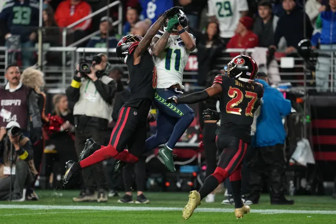 Jan 3, 2026; Santa Clara, California, USA; Seattle Seahawks wide receiver Jaxon Smith-Njigba (11) makes a catch against San Francisco 49ers safety Ji'ayir Brown (27) during the first half at Levi's Stadium. Mandatory Credit: Neville E. Guard-Imagn Images