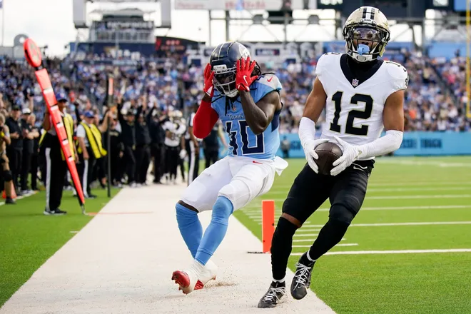 Tennessee Titans cornerback Kemon Hall (40) reacts as New Orleans Saints wide receiver Chris Olave (12) brings in a touchdown during the third quarter at Nissan Stadium in Nashville, Tenn., Sunday, Dec. 28, 2025.