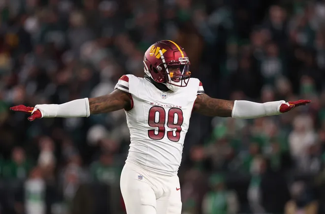 PHILADELPHIA, PENNSYLVANIA - NOVEMBER 14: Clelin Ferrell #99 of the Washington Commanders celebrates after a missed field goal attempt by the Philadelphia Eagles during the first quarter at Lincoln Financial Field on November 14, 2024 in Philadelphia, Pennsylvania. (Photo by Elsa/Getty Images)