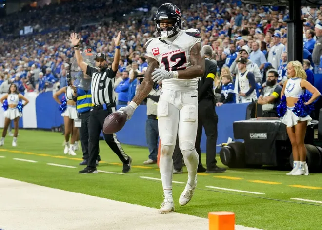 Houston Texans wide receiver Nico Collins (12) scores a touchdown Sunday, Nov. 30, 2025, during a game against the Indianapolis Colts at Lucas Oil Stadium in Indianapolis.