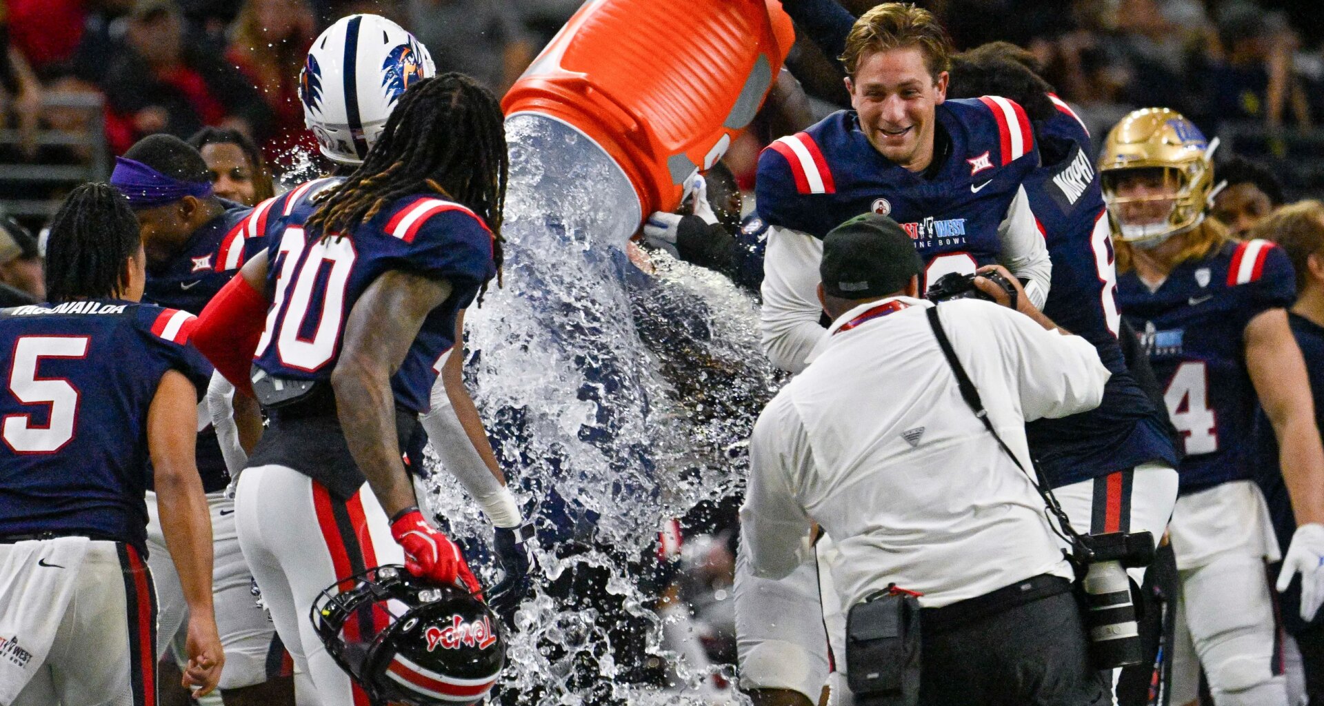 Saints coach Adam Gristick works East-West Shrine Bowl