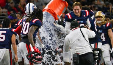 Saints coach Adam Gristick works East-West Shrine Bowl