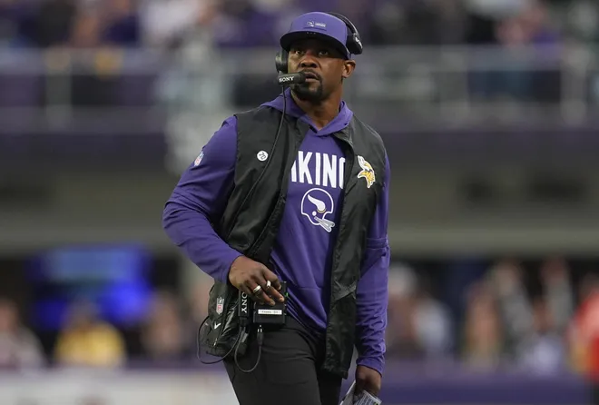 Jan 4, 2026; Minneapolis, Minnesota, USA; Minnesota Vikings defensive coordinator Brian Flores looks on against the Green Bay Packers during the fourth quarter at U.S. Bank Stadium. Mandatory Credit: Matt Blewett-Imagn Images