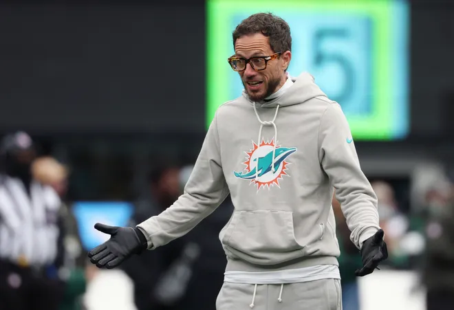 Dec 7, 2025; East Rutherford, New Jersey, USA; Miami Dolphins head coach Mike McDaniel reacts during warmups before the game between the Miami Dolphins and New York Jets at MetLife Stadium. Mandatory Credit: Ed Mulholland-Imagn Images