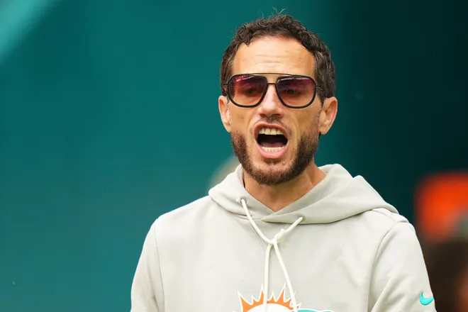 Nov 30, 2025; Miami Gardens, Florida, USA; Miami Dolphins head coach Mike McDaniel stands on the field prior to a game against the New Orleans Saints at Hard Rock Stadium. Mandatory Credit: Rich Storry-Imagn Images