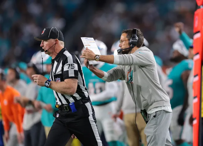 Oct 30, 2025; Miami Gardens, Florida, USA; Miami Dolphins head coach Mike McDaniel calls a time out during the second quarter against the Baltimore Ravens at Hard Rock Stadium. Mandatory Credit: Sam Navarro-Imagn Images