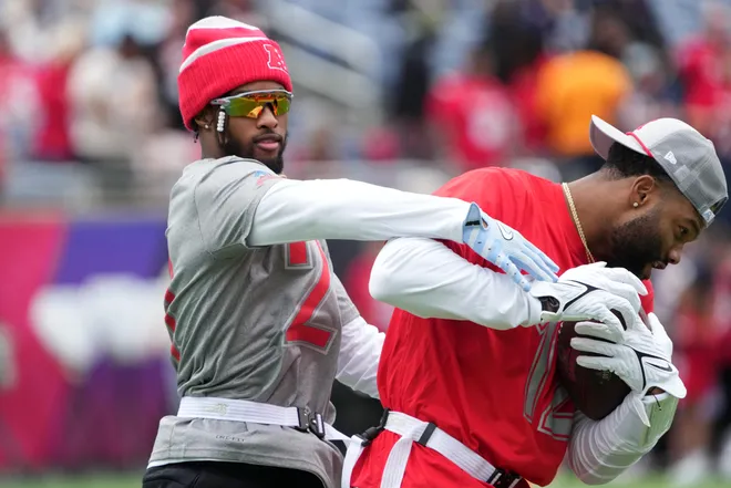 Feb 1, 2025; Orlando, FL, USA; Cleveland Browns cornerback Denzel Ward (21) and Houston Texans receiver Nico Collins (12) during AFC Practice for the Pro Bowl Games at Camping World Stadium. Mandatory Credit: Kirby Lee-Imagn Images