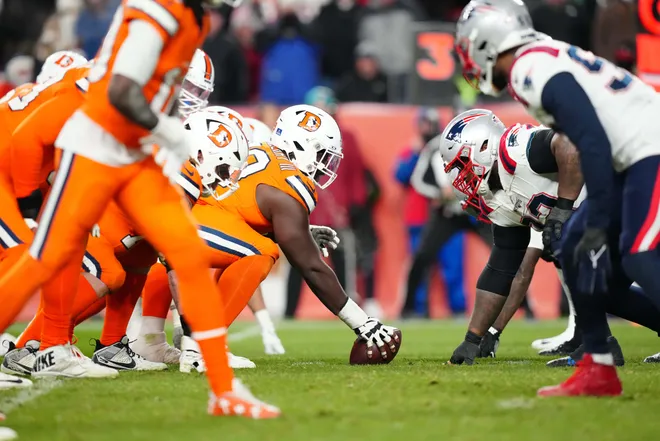 Dec 24, 2023; Denver, Colorado, USA; Members of the New England Patriots line up across from the Denver Broncos in the fourth quarter at Empower Field at Mile High. Mandatory Credit: Ron Chenoy-USA TODAY Sports
