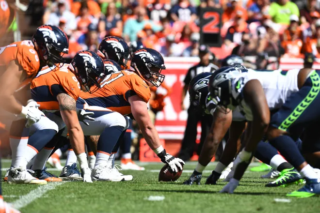 Sep 9, 2018; Denver, CO, USA; Denver Broncos center Matt Paradis (61) lines up to snap the football in the first quarter against the Seattle Seahawks at Broncos Stadium at Mile High. Mandatory Credit: Ron Chenoy-USA TODAY Sports