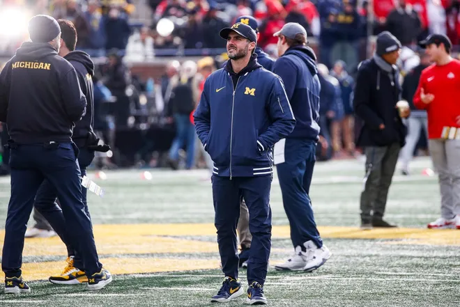 Michigan defensive coordinator Jesse Minter watches warmups before the Ohio State game at Michigan Stadium in Ann Arbor on Saturday, Nov. 25, 2023.