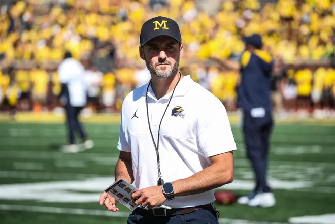 Michigan interim head coach Jesse Minter watches warm up before the East Carolina game at Michigan Stadium in Ann Arbor, Saturday, Sept. 2, 2023.