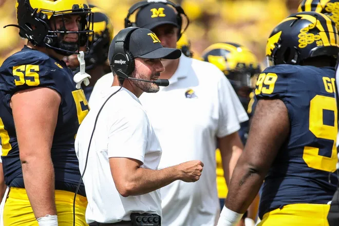Michigan interim head coach Jesse Minter talks to players at a timeout against East Carolina during the second half of U-M's 30-3 win on Saturday, Sept. 2, 2023, at Michigan Stadium.