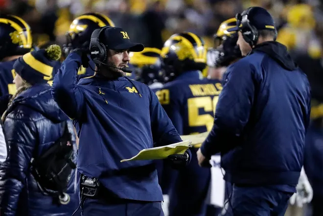Michigan defensive coordinator Jesse Minter talks to players at a timeout against Nebraska during the second half of U-M's 34-3 win over Nebraska on Saturday, Nov. 12, 2022, in Ann Arbor.