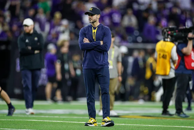Michigan defensive coordinator Jesse Minter watches warm ups before the national championship game at NRG Stadium in Houston on Monday, Jan. 8, 2024.