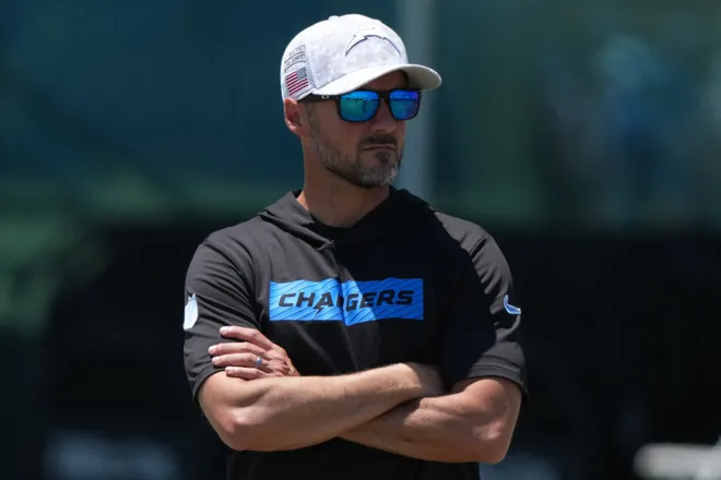 Jun 16, 2025; El Segundo, CA, USA; Los Angeles Chargers defensive coordinator Jesse Minter watches during organized team activities at The Bolt. Mandatory Credit: Kirby Lee-Imagn Images